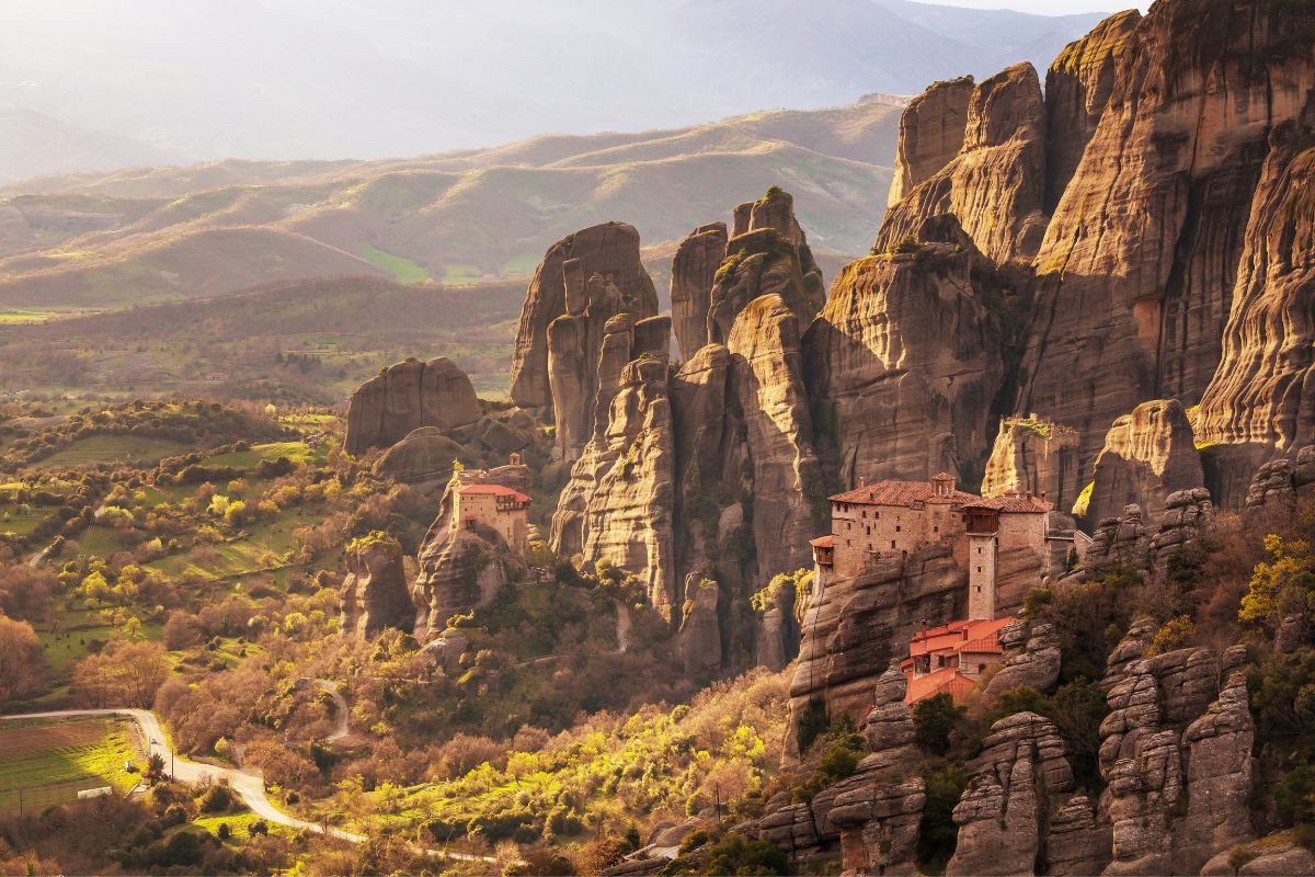 Scenic view of Meteora, Greece, showcasing monasteries perched on top of towering rock formations.